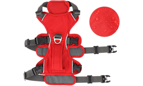 Red waterproof dog harness with adjustable straps, suitable for different types of dogs, with sturdy handle.