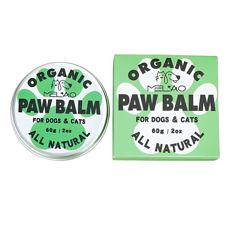 Organic Paw Balm for Dogs and Cats Green and white tin and box of organic, all-natural paw balm for dogs and cats, 60g, to soothe and protect pet paw pads.